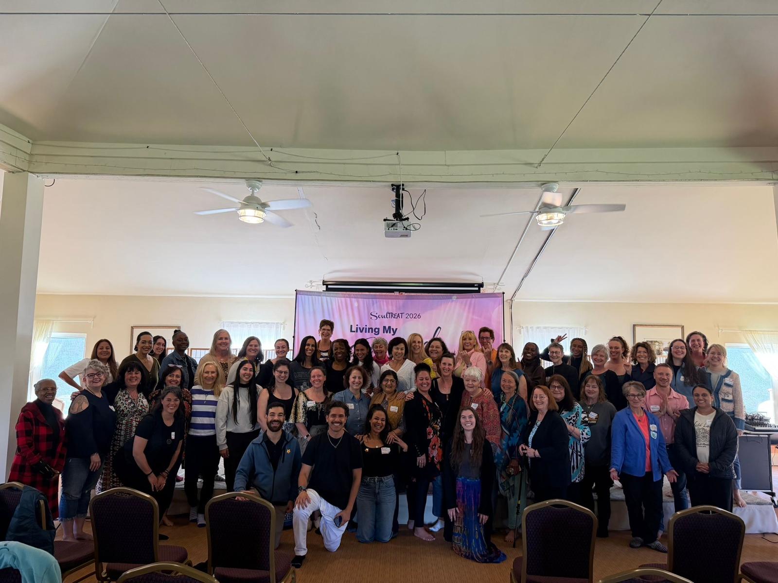 Anna Pereira with participants at The Wellness Universe SoulTreat retreat in 2026