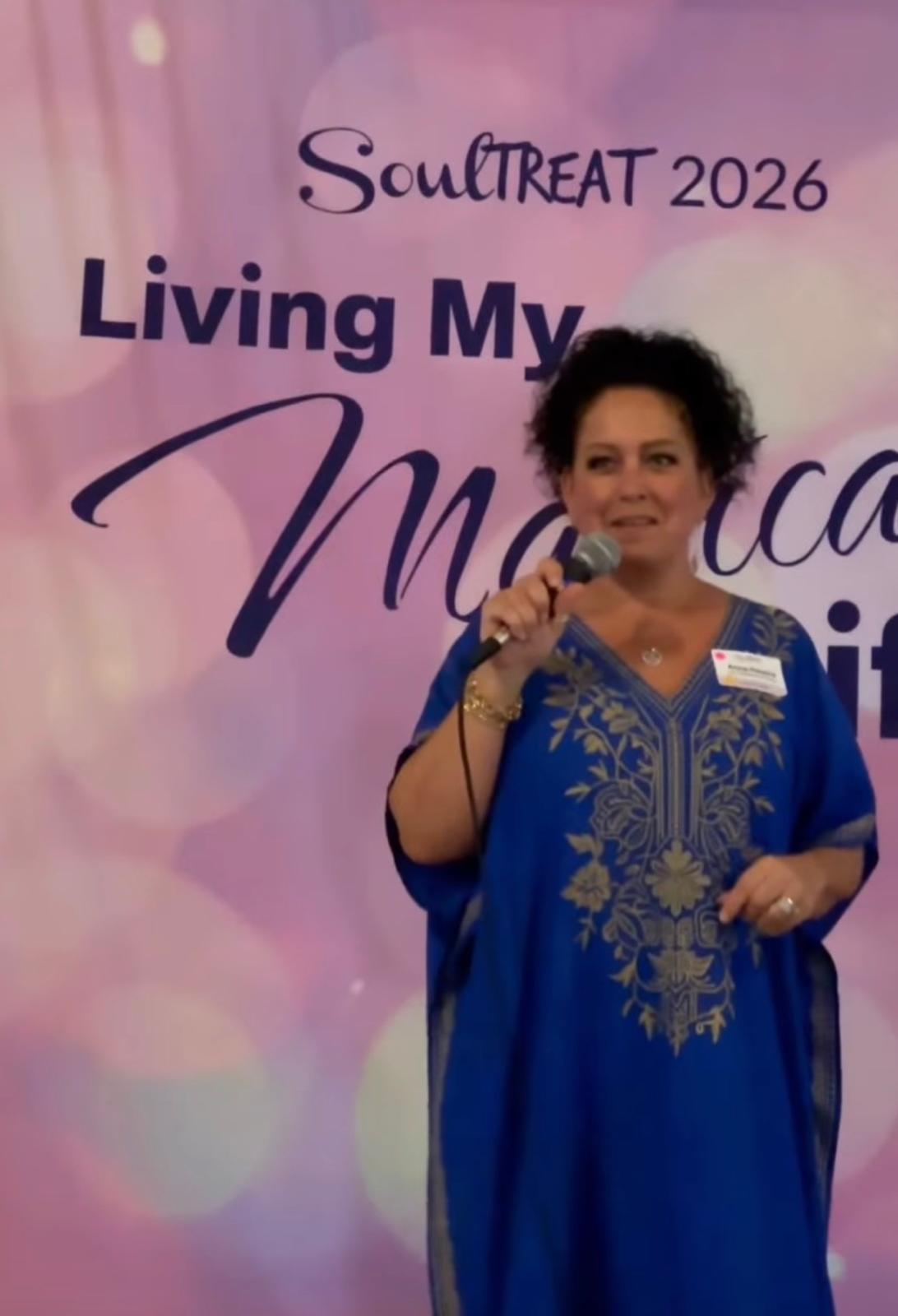 Anna Pereira speaking at The Wellness Universe SoulTreat retreat in 2026